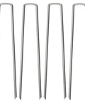 Four 12-inch landscape staples made of galvanized steel for garden fence and weed barrier fabric installation.