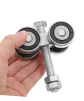 Stainless Steel Double Bearing Caster Wheel For Sliding Gates And Barn Doors Heavy Duty Track Roller held in hand, side view.