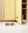 4 Pack 8cm Rubberwood Turned Gourd Shaped Furniture Legs Replacement For Tables And Dressers on a floor near a cabinet