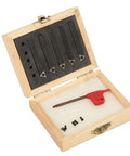 Five 1/4in indexable turning tools with carbide inserts in a wooden box; includes red-handled tool and small screws.