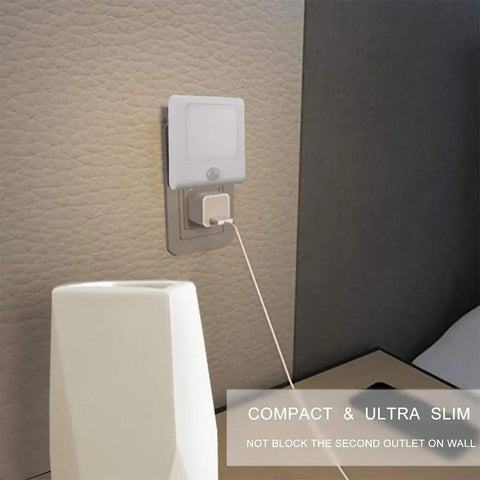 Compact 3 Pack No Fuss Motion Sensor Dimmable LED Night Lights Plug In Night Light installed, showing auto dusk-to-dawn sensor