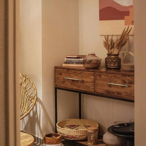 Living room with cabinet featuring Vintage Retro Antique Brass Zinc Alloy Cabinet Handles 6 Pack, decorated with books and plants.