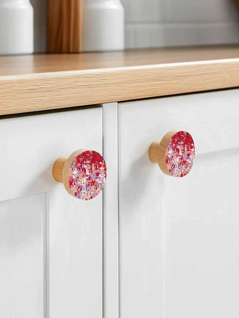 Killer Red Abstract Painted Wooden Cabinet Knobs 2 Piece Set 1.4 Inch Round Drawer Pulls For Kitchen Cabinets displayed on bright drawers.