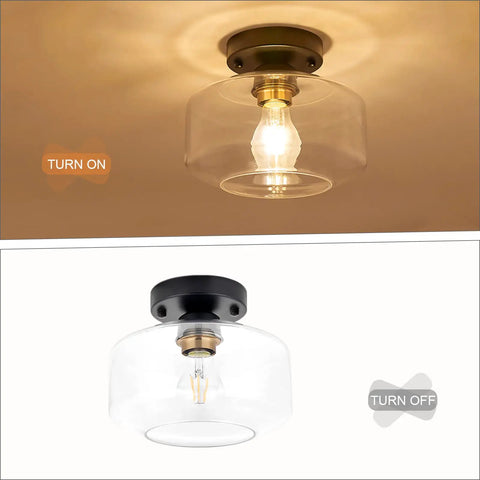Semi Flush Mount Ceiling Light With Matte Black Finish And 8.66 Inch Clear Hand Blown Glass Shade, Slick Brass Accent Socket.
