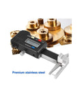 Three In One Digital Caliper For Jewelry And DIY Projects Stainless Steel Gauge next to small gold gears, LCD display visible