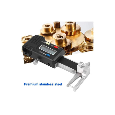 Three In One Digital Caliper For Jewelry And DIY Projects Stainless Steel Gauge next to small gold gears, LCD display visible