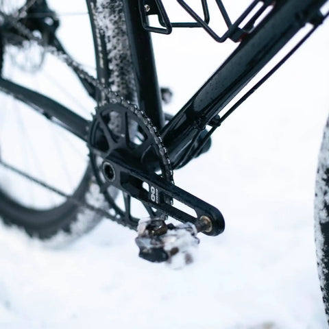 Close-up of a bike with Ultralight Road Bike Crankset With Hollow Tech Arm 3 Bolt Direct Mount for gravel use.