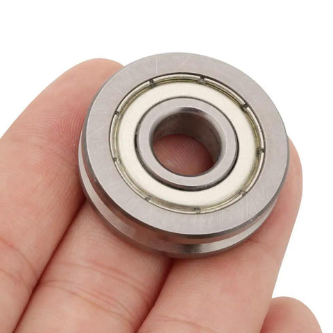 Tough As Nails 10mm Bore 30mm OD 8mm Thick V Groove Stainless Steel Deep Groove Ball Bearing in hand.