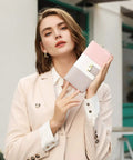 Woman holding RFID Blocking Large Capacity Womens Bifold Wallet With ID Window Zipper Coin Pocket Dope Ice Cream Design Vegan PU Leather