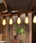 Dope Bronze Linear Island Light With Guitar Shade, Industrial Farmhouse Ceiling Fixture, glowing E26 bulbs in kitchen setting