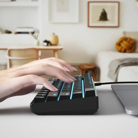 Person typing on Badass Portable 61 Key Mechanical Gaming Keyboard With Vivid Led Backlight Ultra Compact 60 Layout Usb C Cord