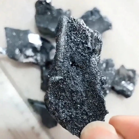 Close-up of High Purity Boron Small Block Crystals 99.99 Percent Metalloids Element For Lab Use 1 To 5 Grams in hand