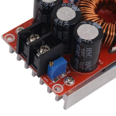 Close-up view of the Beefy 1200W 20A DC-DC Boost Converter for Cars, showing capacitors and adjustable components.
