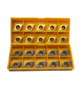 Top view of yellow plastic storage case with 20 DCMT11T304/DCMT32.51 carbide turning inserts, multilayer-coated