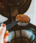 Two In One Coffee Scoop And Measuring Spoon 304 Stainless Steel with ground coffee in spoon