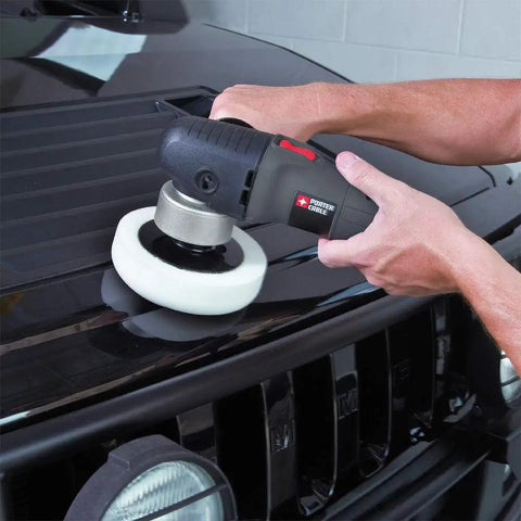 Person using Powerful 4.5 Amp 6 Inch Orbital Sander And Polisher With Variable Speed 2,500 To 6,800 OPM Corded for swirl-free car polishing