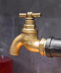 Industrial Iron Pipe Wine Rack For Home Bar Flex, Vintage golden faucet detail showcasing heavy-duty metal design.