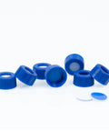 Premium Quality 100 Pack Blue 9 Mm Screw Thread HPLC Vial Caps Featuring Pre Slit PTFE Lined Septa laid out, showcasing blue screw caps.
