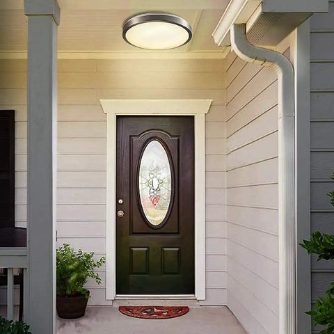 16 Inch LED Motion Sensor Ceiling Light With 23W 1200LM Daylight Sensor For Indoor Use No Fuss Easy Install In Hallways Pantry Garage Balcony Porch Basement 3000K Warm White Motion Activated Ceiling Fixture installed above porch door.