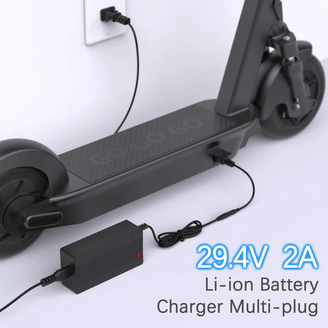 Universal 29.4V 2A Charger for 7S LiIon Batteries charging an e-scooter via a wall socket with interchangeable plugs.