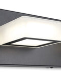 Close-up of Three Light Black Vanity Lighting Fixture With Acrylic Shades, modern design showing sleek black metal frame and natural white light