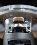 Close-up of Professional Router Subbase Centering Pin And Cone Set for precise collet alignment in woodworking.