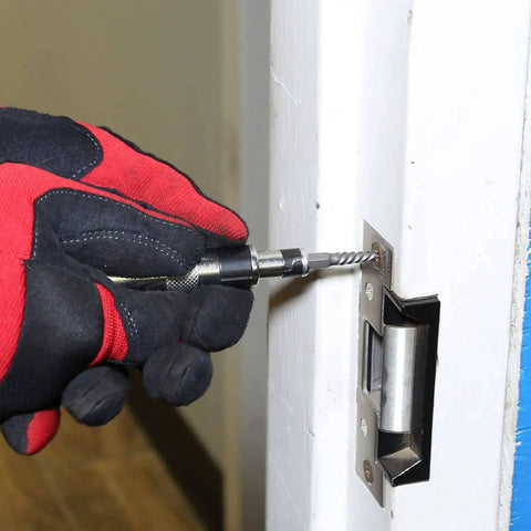 Mini Impact Driver Set With One Quarter Inch Drive For Tight Spaces being used on a door latch.