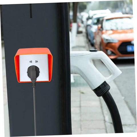 Badass Heavy Duty Ev Charger Cover And Weatherproof Outlet Protector For 86 Type Electrical Jack Plates with orange shell mounted over an outlet.