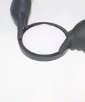 Hands holding 7-Inch LED Pancake Light Surface Mount Dimmable Wet Location Super Slim Fixture Bronze for installation.