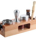 Rock Solid Fifty Eight Mm Espresso Tamping Station Made From Sturdy Natural Wood, featuring slots for tools and espresso gear.