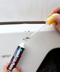 Using 2-In-1 Car Touch Up Paint Pen For Quick Scratch Repair And Seamless Color Fill on white vehicle surface, 0.8 Fl Oz