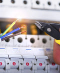 HongWay 5-inch micro flush cutter with yellow handle cutting copper wires near a circuit breaker panel