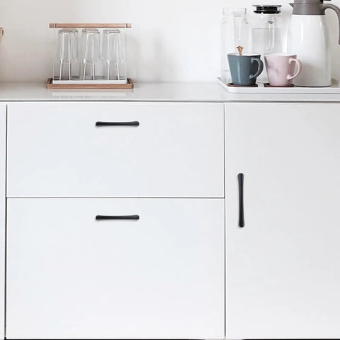 Top Shelf 10 Pack 5 Inch Matte Black Cabinet Pulls featuring Hella Sturdy Zinc Alloy body on modern white cabinetry.