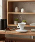 Classic White Bone China Espresso Cup And Saucer Set Designed For Your Daily Coffee Grind Holds 3.4 Ounces Of Precision Shots, displayed with steam.