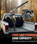 Built Tough Heavy Duty Folding Engine Hoist And Pickup Bed Tailgate Crane With Slick Hydraulic Winch lifting a 2000 lbs engine in a truck.