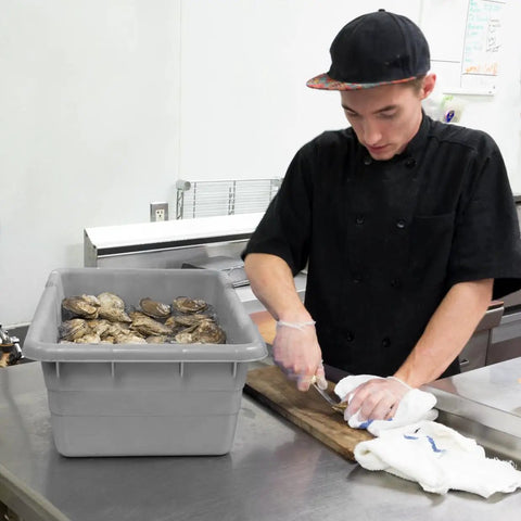 Chef using Jumbo Lug Plastic Nest And Cross Stack Totes 25x16x9 Inch Gray 6 Pack Heavy Duty Storage Bins For Bus Tub Food Service