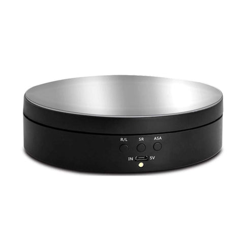Front view of EKDJKK motorized rotating display turntable with silver top and black base, USB/battery powered