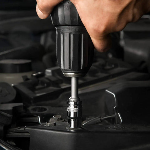 Close-up of hand using Pro Grade 122 Piece Mechanics Tool Set With Sockets And Ratchets In SAE And Metric For Auto And Home Repairs