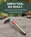 Hounen Miyawaki Japanese Weeding Sickle Twisted Stainless Kama Weeder with 4.7 Inch Blade on wood table in garden setting.