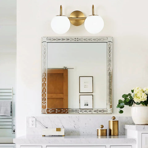 Modern Bathroom Vanity Light Fixtures With Two Lights Brushed Brass Finish And Milk White Globe Glass Shade Wall Bar Sconce Lighting Over Mirror For Bath Vanity Dresser Or Study Room Easy Installation shown above a mirror in a bathroom setting
