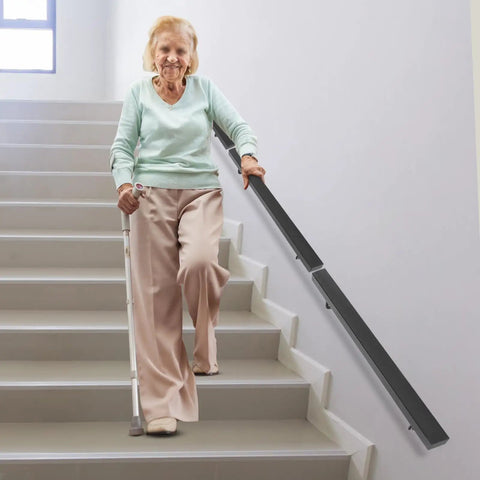 Premium Flush Handrail Set Stainless Steel Wall Mounted Indoor Outdoor Stair Railing With Heavy Duty Mounts Built Like A Tank And Rock Solid For Daily Projects, supporting elderly woman on stairs.