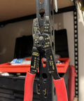 Heavy Duty Garage Shelf Hook For Keyhole Slots with red-handled wire stripper hanging, showing slide-in storage function in workshop.