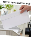 Person holding white envelope from White 100 Pack Self Seal Envelopes With Peel And Seal Privacy Protection For Letter Size Mail