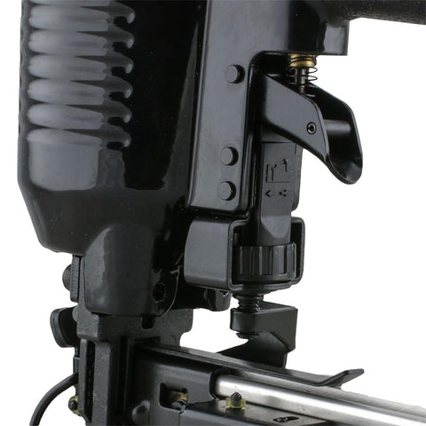 Close-up of Pneumatic 16 Gauge Fencing Stapler's depth adjust and jam release mechanisms, shown in black metal casing.