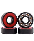 Front view of four Z-First 608RS hybrid black ceramic bearings with red seals and visible white balls.