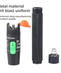 Visual fault locator fiber optic tester pen with green switch, black textured body, separate cap and spring.