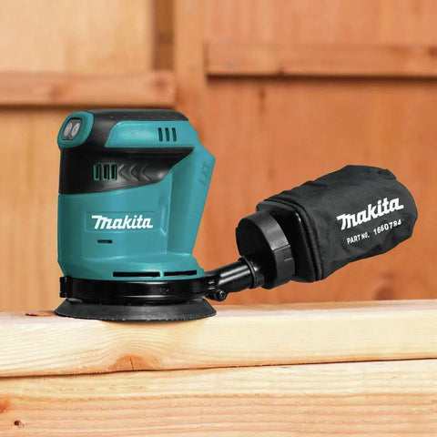 Cordless 5 Inch Random Orbit Sander 18V LXT With Three Speed Settings 7000 9500 11000 OPM on wood surface