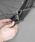Bike Chain Tool Set Pro Grade 2 In 1 Chain Breaker in use on a bike chain for 6 to 10 speed chains repair