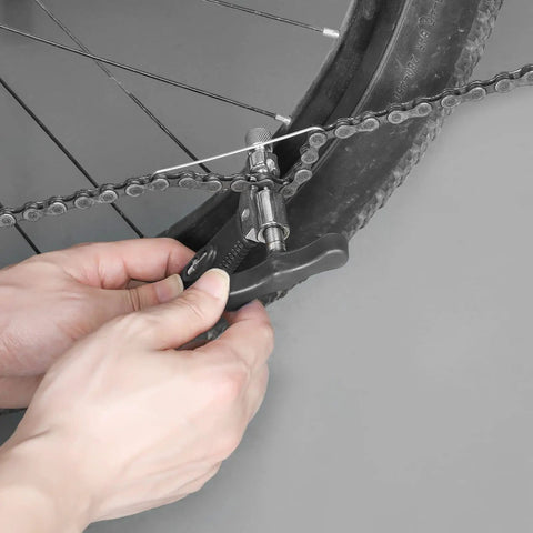 Bike Chain Tool Set Pro Grade 2 In 1 Chain Breaker in use on a bike chain for 6 to 10 speed chains repair