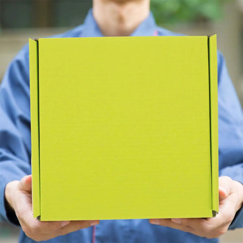 Person holding Green Corrugated Storage Boxes 10 Pack Ultra Strong Yet Lightweight For Shipping And Moving Quick Assembly Without Tape